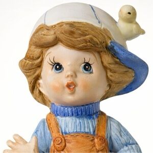 Vintage Ceramic Boy Figurine in Blue and Orange Overalls